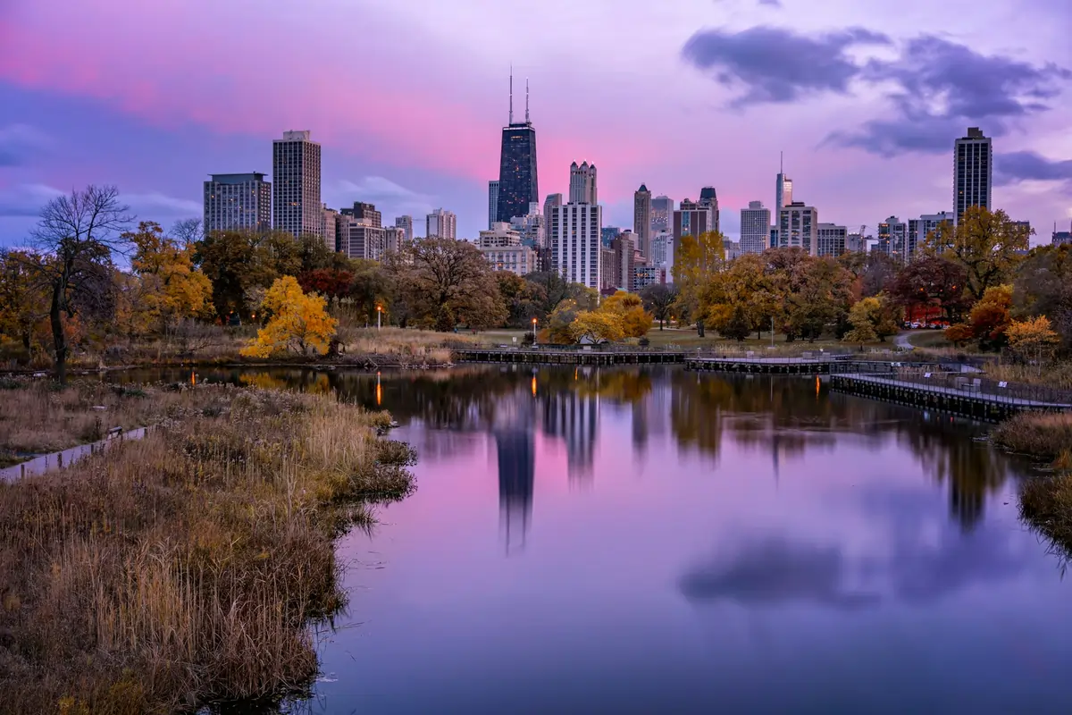 The Chicago skyline viewed from Lincoln Park, one of the Safest Neighborhoods in Chicago, at sunset.