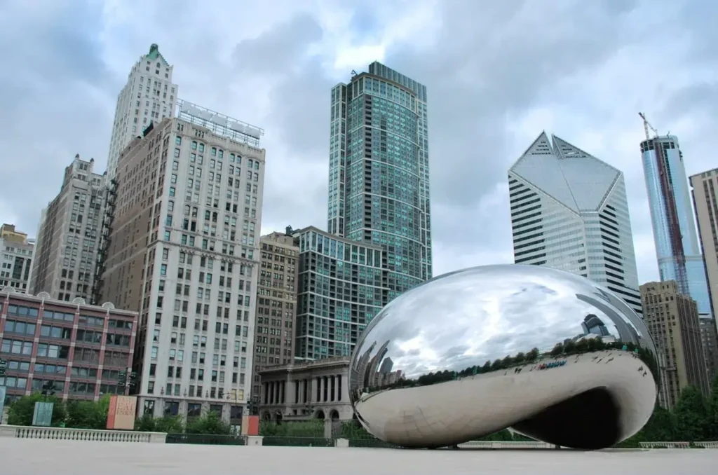 The iconic Cloud Gate sculpture in The Loop Millennium Park, one of the safest neighborhoods in Chicago.