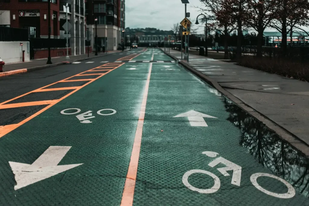 A two-way protected bike lane with arrows showing the correct direction of travel, illustrating common mistakes to avoid with Bike Lane Rules California.