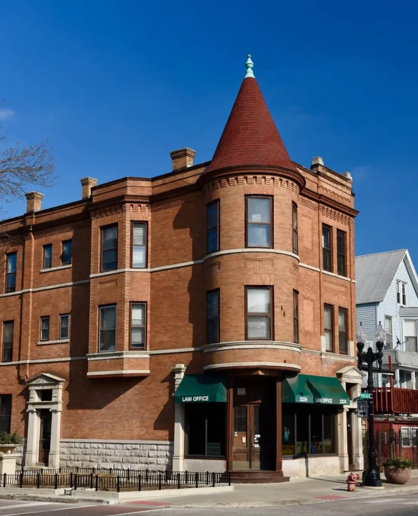 A historic brick corner building with a distinctive turret in Ravenswood Manor, one of the safest neighborhoods in Chicago.