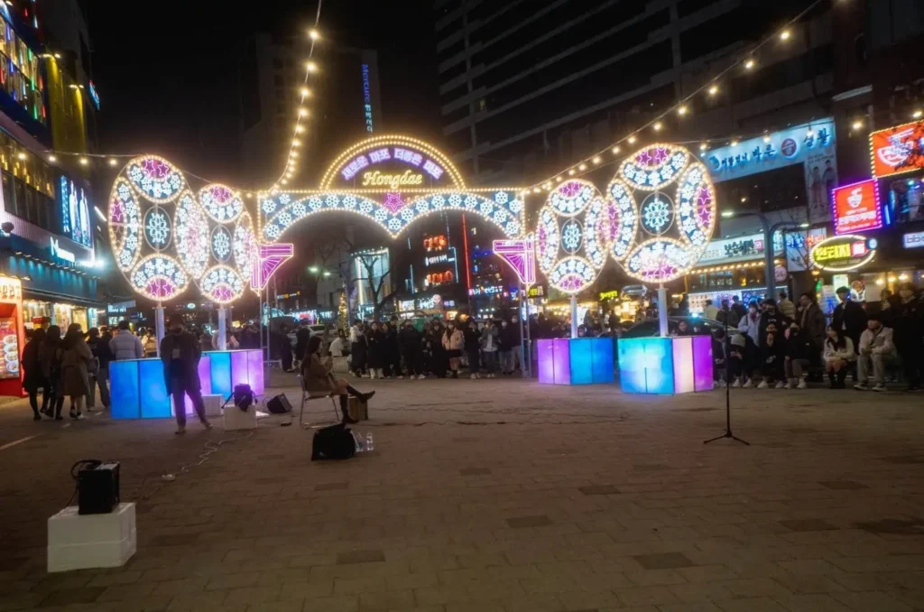 A street performance at night in the Hongdae district of Seoul, one of the top cities in Asia for youth culture and nightlife.