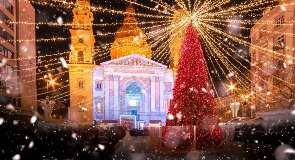 The award-winning Advent Basilica market in Budapest, one of the best Christmas markets in Europe, with a giant red Christmas tree and light show in front of St. Stephen's Basilica.