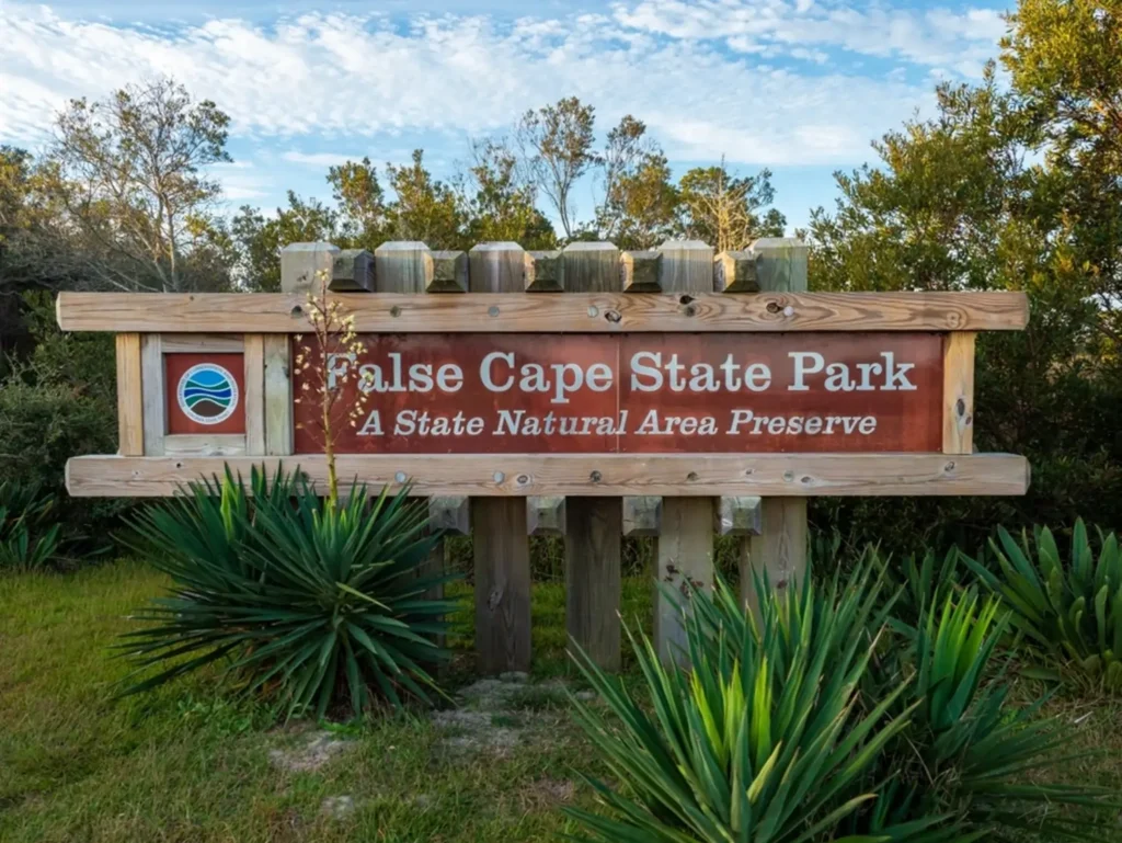 The wooden entrance sign for False Cape State Park, one of the most secluded family beaches on the East Coast.