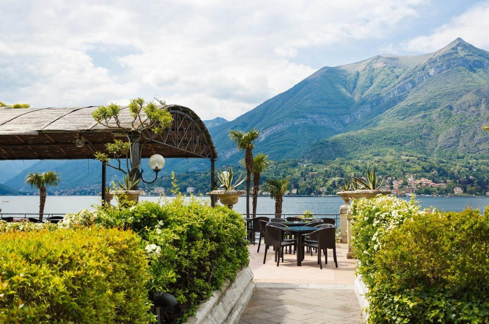 Lake Como villa terrace dining with romantic mountain lake views
