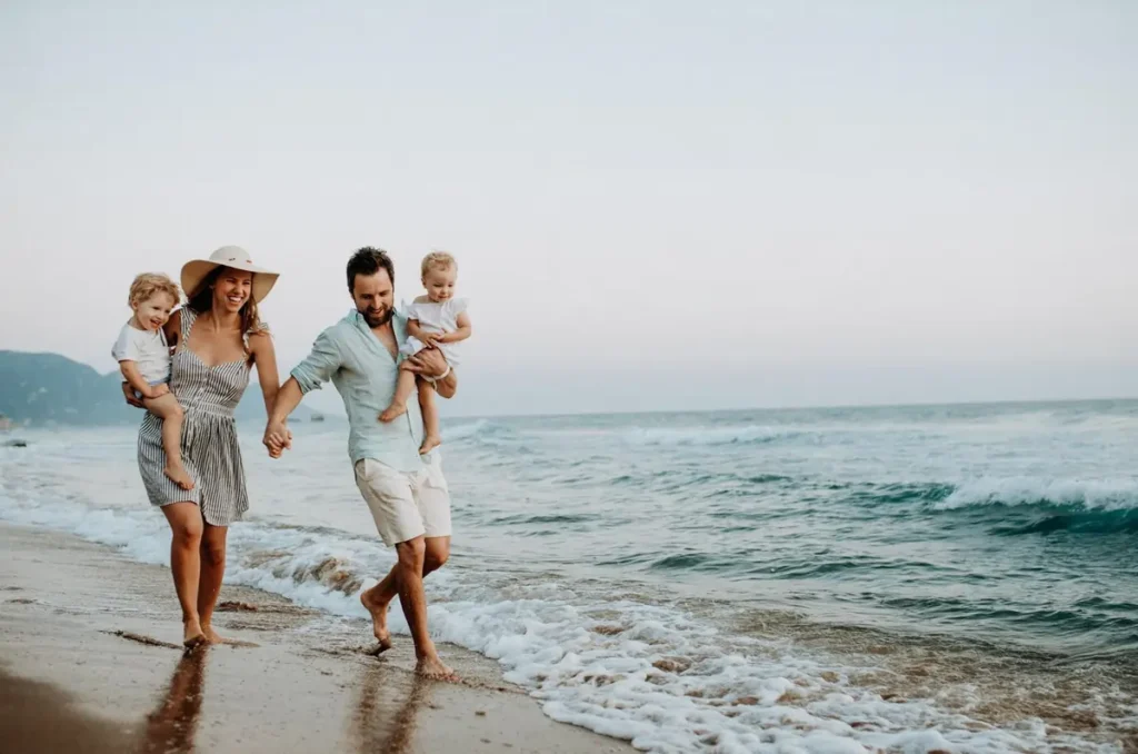 Family enjoying the gentle waves and sandy shores at a quiet East Coast beach near Corolla, North Carolina